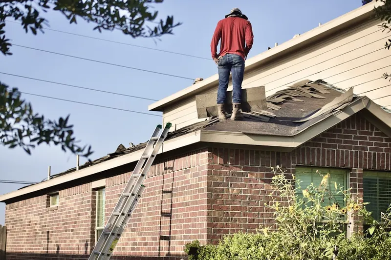 Professional roofer working on a residential roof in Dove Valley